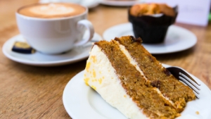 The Old Pottery Restaurant. A slice of cake with a coffee.